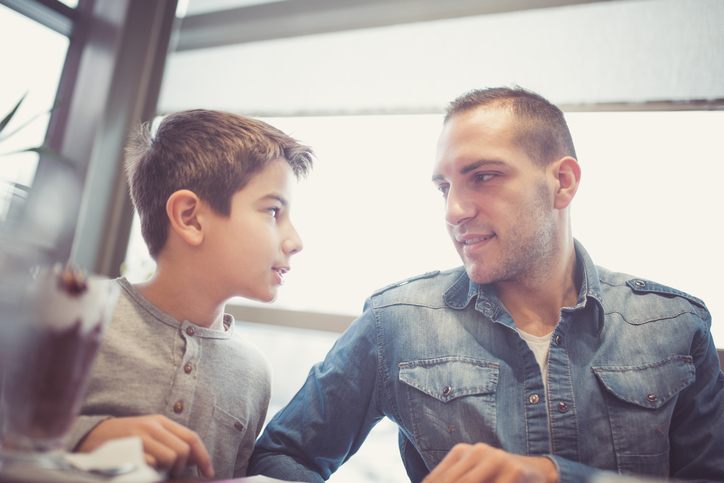 Dad talking to son