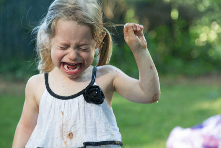 Young child with muddy clothes