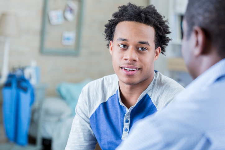 Teen talking to an adult