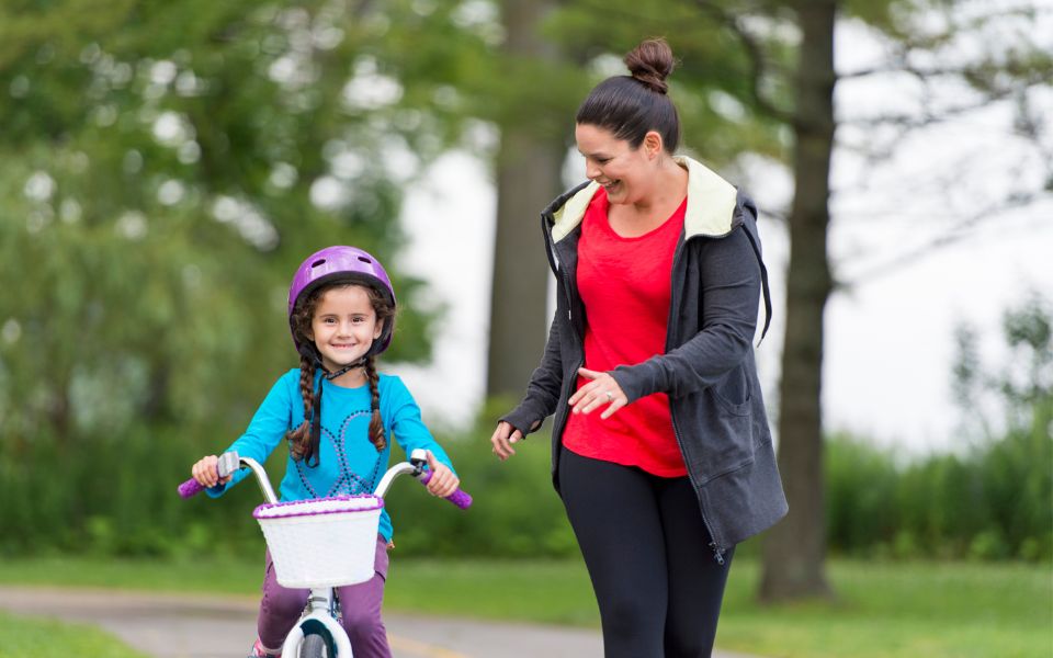 mom and daughter riding bike