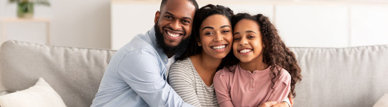 Mother and father holding daughter
