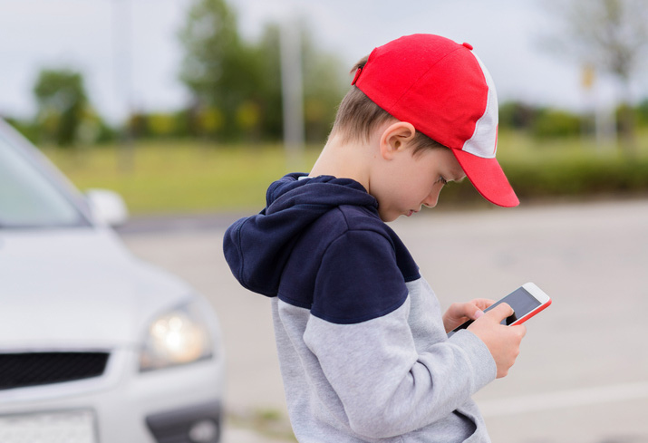 Child looking at cell phone