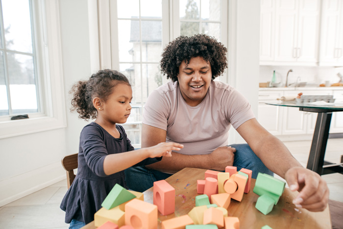 Boys Town - Father helping Daughter with Blocks