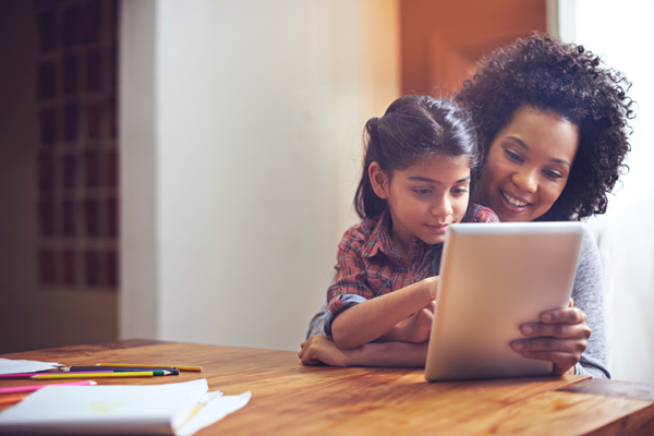 Mom and daughter looking at tablet