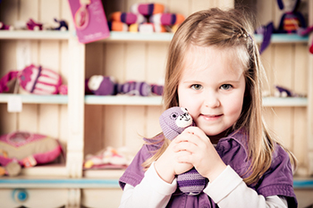 Girl hugging stuffed animal