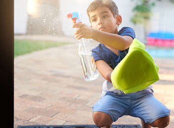 Boy washing windows