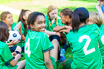 Youth sports team in a huddle