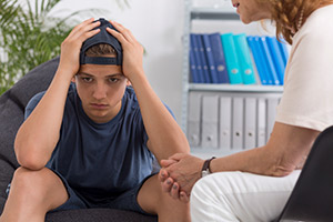 Teen looking overwhelmed, sad