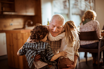 Grandkids hugging grandpa