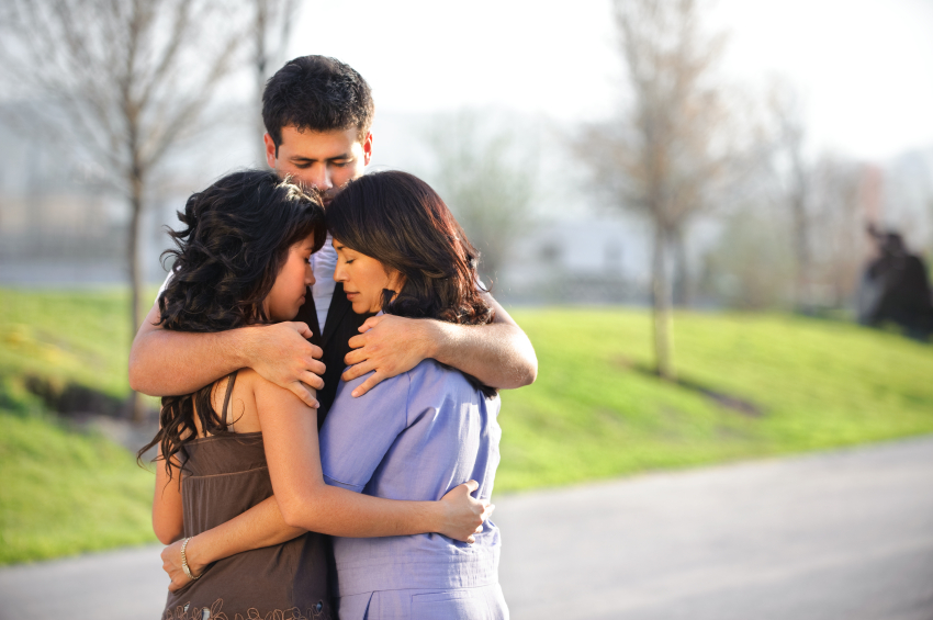 Family hugging after crisis