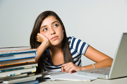 Teen with stack of homework
