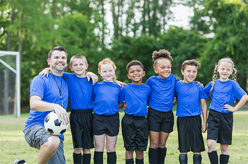 A soccer team and their coach