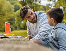 Dad talking to son