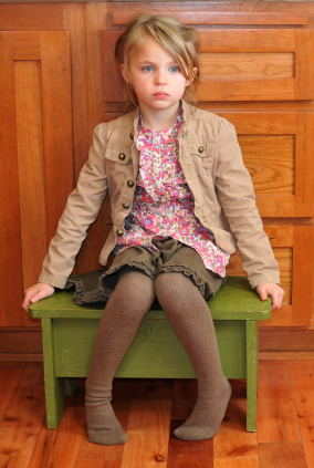 Girl sitting on timeout chair
